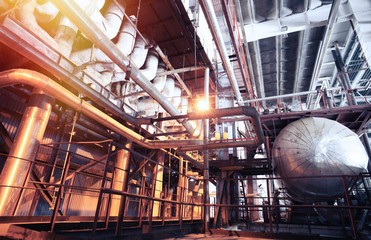 different size and shaped pipes and valves at a power plant