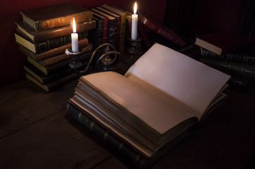 Old Book Lit Up With Candles