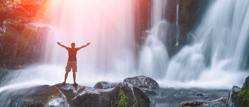 Man on a Great waterfall © Bashkatov