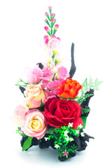 Artificial flowers bouquet in the vase isolated on white