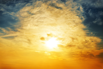 sun and orange clouds in sunset