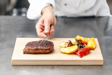 Chef served beef steak