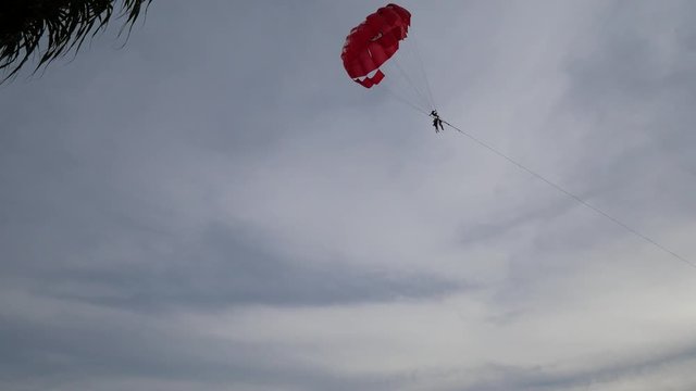 4K parasail on the beach with sunset background , Phuket , Thailand