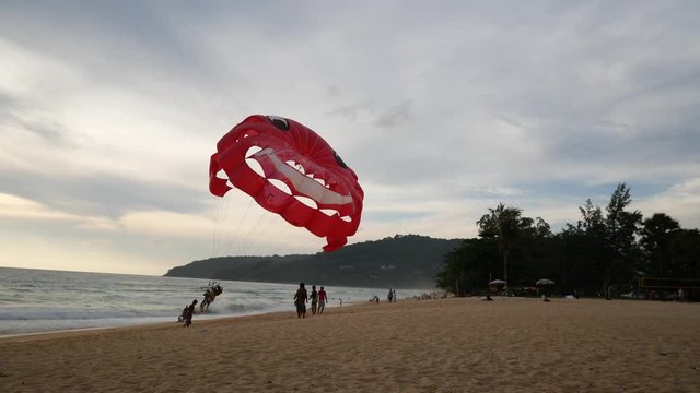 4K parasail on the beach with sunset background , Phuket , Thailand