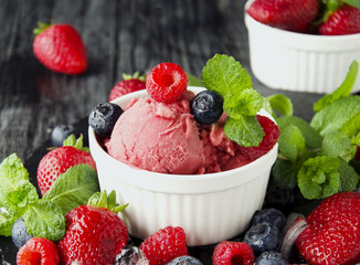 fruit ice cream with fresh strawberries, blueberries and raspberries