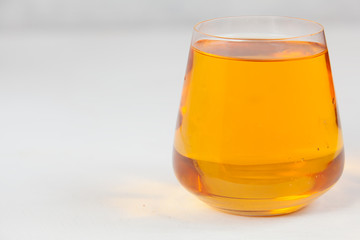 Delicious fresh squeezed apple juice in  transparent glass