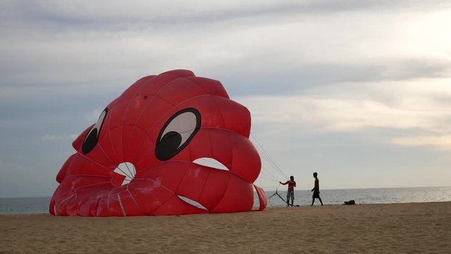 4K parasail on the beach with sunset background , Phuket , Thailand