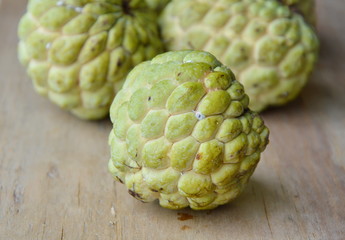 custard apple tropical fruit on wooden board