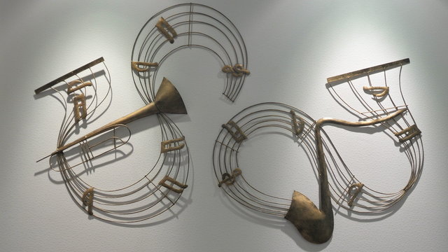 The art of music note on the wall in small sportlight. Vintage style.