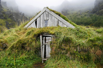 Wooden house isolated with grass in Iceland