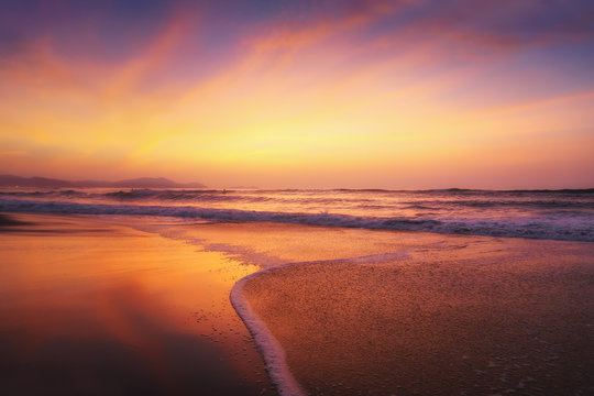 red sunset on beach shore