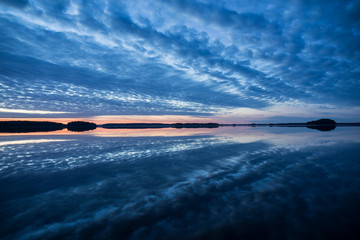 Calm lake reflection in Farnebofjarden national park in Sweden