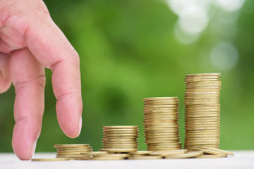 Money Gold coin Steps with green bokeh background ,Business Fina