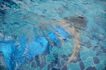 Fototapeta premium Swimsuit mermaid in the pool