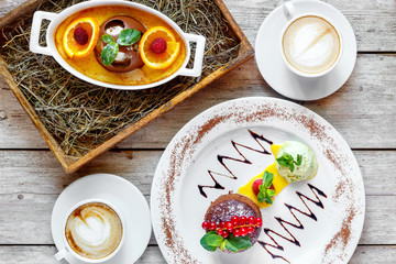 Dessert with coffee on the wooden table-chocolate fondant