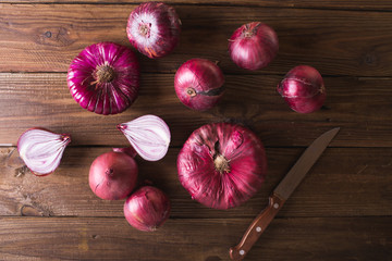 Red sweet onion on a wooden background