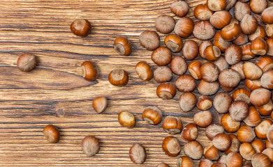 Hazelnuts on wooden background. Top view