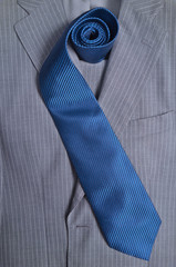 Classic gray striped business suit and blue tie. Fashion and classic trends