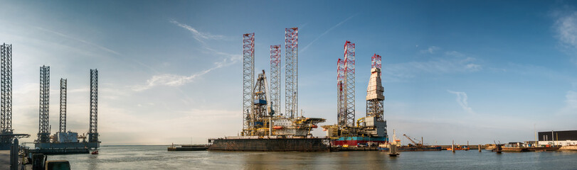 Oil rigs in Esbjerg harbor, Denmark - obrazy, fototapety, plakaty