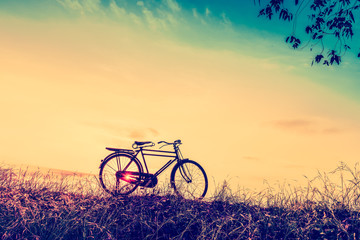 Fototapeta na wymiar beautiful landscape image with Silhouette Bicycle at sunset in