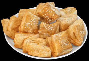 Plateful Of Zu-Zu Square Croissant Puff Pastry Isolated On Black Background