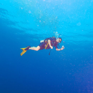 Diver with bright yellow fins