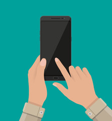 Hand touching screen of black smartphone