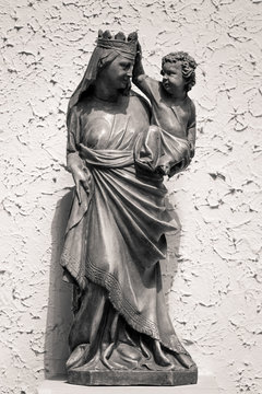 Antique virgin Mary statue with baby