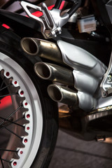 Sport modern Motorcycle tailpipe detail.