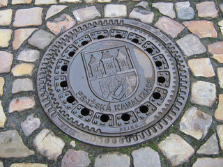 Manhole cover on old street