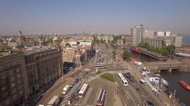 Amsterdam aerial sightseeing. Flying above old centre district. 4K