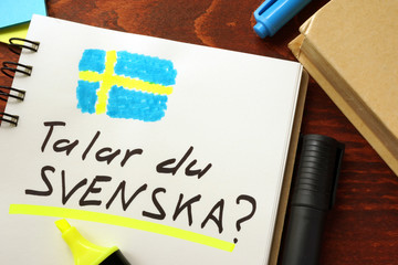 Learn swedish written in a notepad.  Education concept.