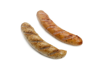 Fried smoked sausages or bratwurst isolated on white background