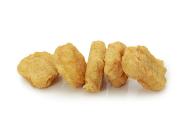 Fried chicken nuggets isolated on white background.