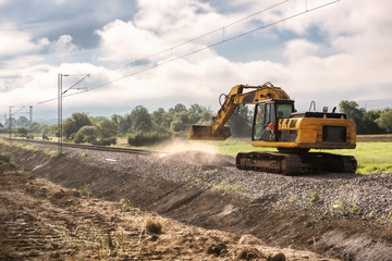 Repairing the railway line -Excavators on reconstruction of the railway rails