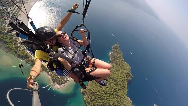 Tandem paragliding. Fear and joy. Extreme touristic Attraction.