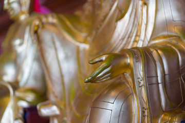 Golden finger of buddha statue in Chinese temple Thailand. (Wat