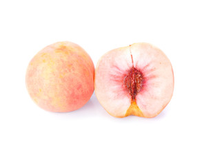 peach fruit with half isolated on white background