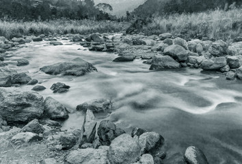 River water flowing through rocks at dawn, Sikkim, India