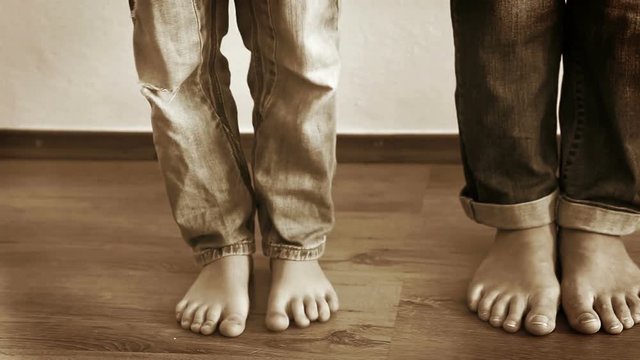 Mother and son step on each other's feet as a prank