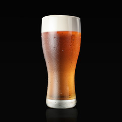 Fresh beer glass isolated on black studio. 