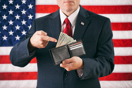 Politician: Man Gesturing To Wallet Full Of Cash