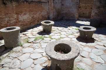 Ruins of Ostia antica, Italy. Mills for grinding cereals in a baker's shop