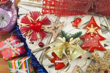 Christmas time.  Decorations for the presents. Christmas ornaments on a wooden board. Home-made Christmas ornaments.
