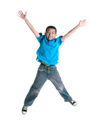 Little boy jumping on white background