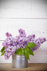 lilac flowers on white wooden background