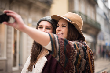 Women taking selfies