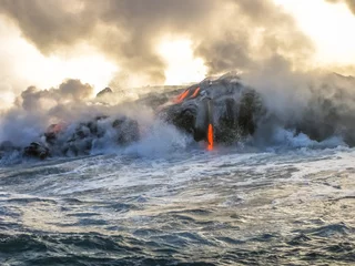 Schilderijen op glas Kilauea Volcano in Hawaii Volcanoes National Park, also known Kilauea Smile because from 2016 seems to smile, erupting lava into Pacific Ocean, Big Island. Scenic sea view of lava rivers into the sea. © bennymarty