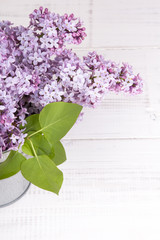 lilac flowers on white wooden background