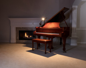 Grand Piano with reading light and glowing fireplace during even